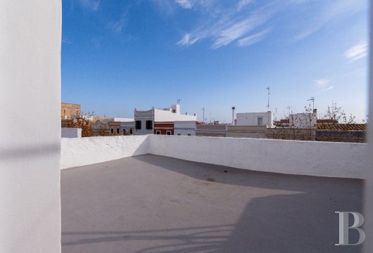 Dans la vieille ville de Ciutadella, une maison de 1860 sur quatre niveaux, son patio et ses terrasses sous le ...